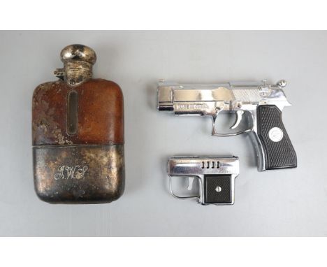 2 Pistol lighters and a hip flask 