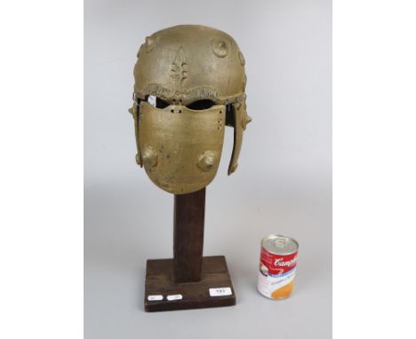 Model of Persian helmet on stand 