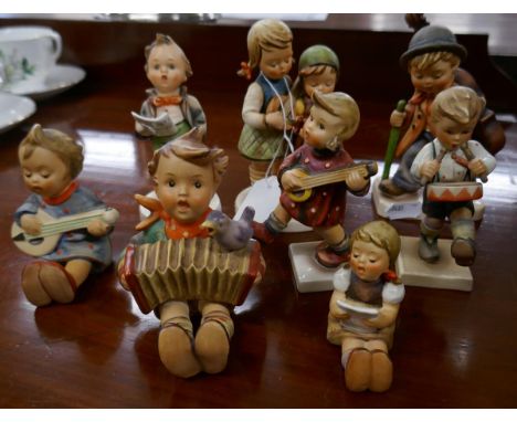 A collection of Goebel figurines with musical theme after sister Marie Hummel's drawings. All are polychrome decorated with m
