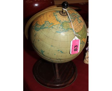 A Chad Valley tiriplate terrestrial globe. 11" high