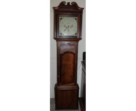 An oak and mahogany longcase clock with 8 day movement, the enamel dial with painted spandrels. 81" high