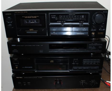	A Rotel amplifier and three other separates