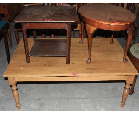 	A light oak coffee table, oval occasional table and a small folding table