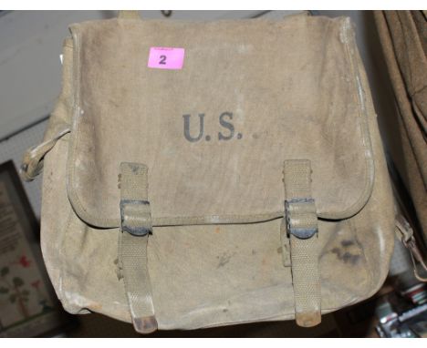 	A British Army uniform, jacket, bag, US army bag and a warden's jacket