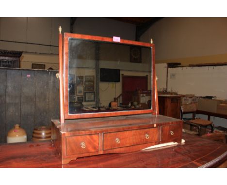 A George IV mahogany dressing table mirror with oblong plate over base with three drawers, on bracket feet. 23" wide