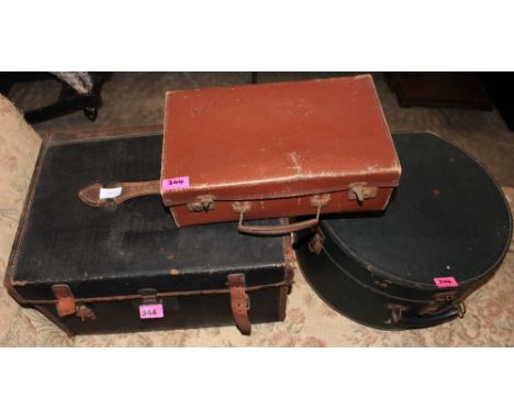 	A canvas and leather automotive trunk and two cases