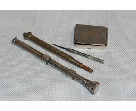 	A silver seal top propelling pen, a silver engine turned pill box, a silver propelling toothpick and a plated propelling pen