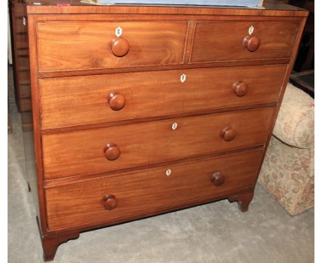 A George III mahogany chest with two short over three long drawers, on bracket feet. 42" wide