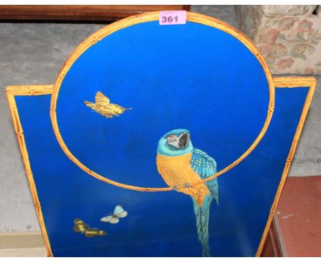 A firescreen painted with a macaw, purchased from Harvey Nichols. 28" high