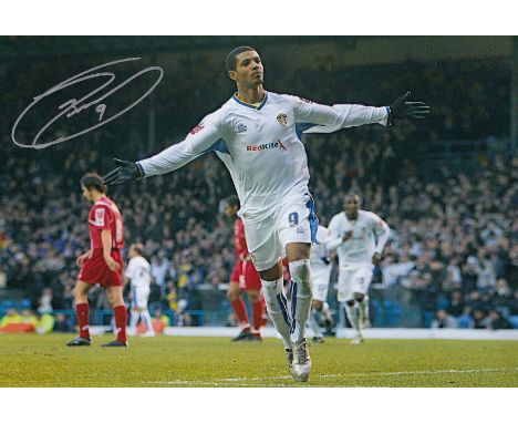 Autographed Jermaine Beckford 12 X 8 Photo : Col, Depicting Leeds United's Jermaine Beckford Celebrating After Scoring His Fi