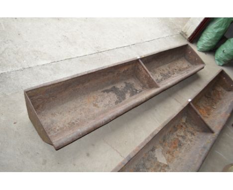 A heavy 8ft cast iron two section feed trough