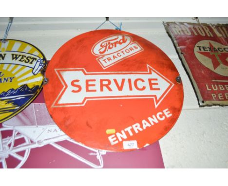 An enamel circular advertising sign "Ford Tractors Service", 18ins dia. approx.