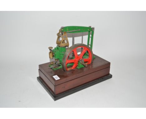 An old model of a horizontal beam engine, on mahogany base