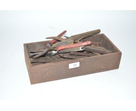 A wooden box and contents of Vintage secateurs