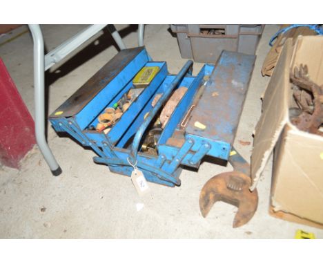 A cantilever toolbox with contents of various Watchmaker's tools and parts