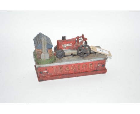 A novelty cast iron moneybox, "Tractor"