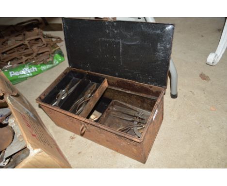 An old metal toolbox and contents, including calipers, pliers etc.