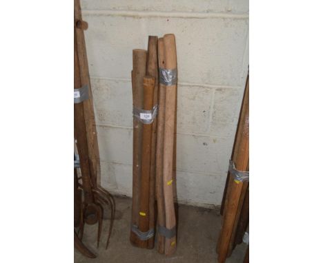 A quantity of wooden axe handles