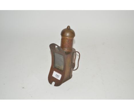 An unusual small brass hand lamp