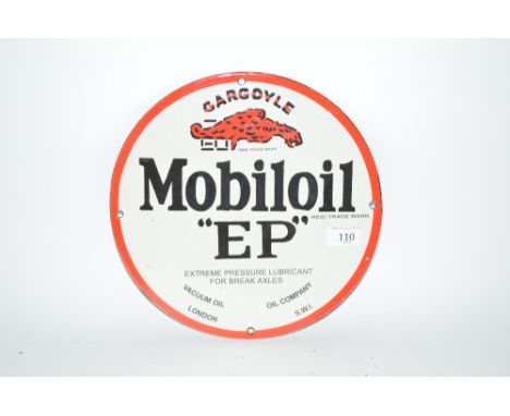 An enamel "Mobiloil E.P." advertising sign, 12ins. dia. approx.