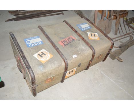 A Vintage canvas and batten trunk with various Union Castle luggage labels attached