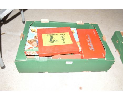 A box containing various games including dominoes, table tennis, Magic Robot, stencil set etc.