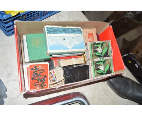 A box of miscellaneous playing cards