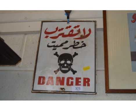 An enamel Warning sign