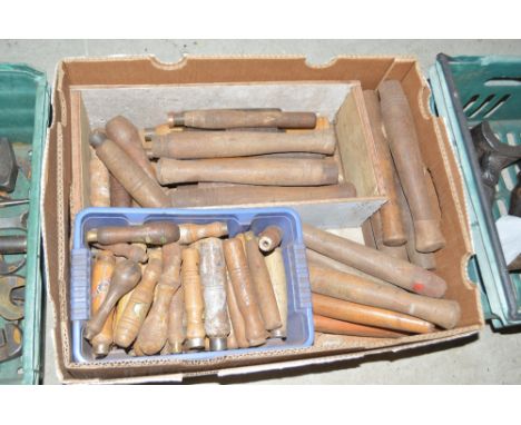 A tray box containing numerous chisel handles etc.