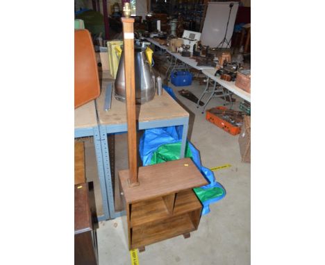 An Art Deco walnut bookshelf with attached lamp
