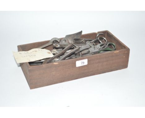 A wooden tray and contents of Vintage secateurs, scissors etc.
