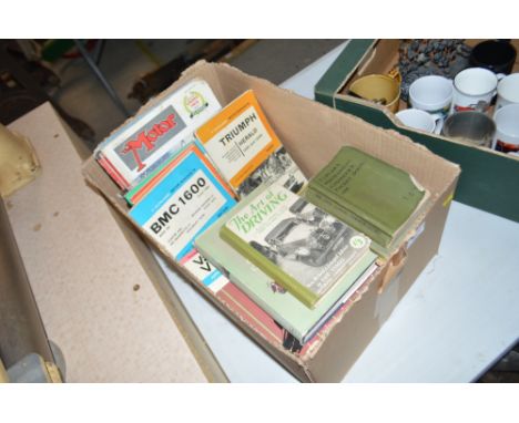 A box of various Vintage car manuals and books