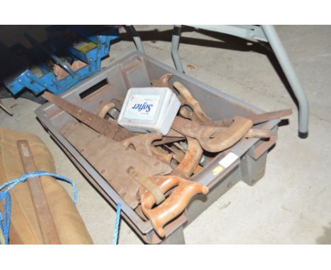 A box containing various Vintage saws