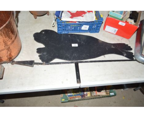A seal shaped weather vane pointer