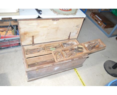 A toolbox and contents of numerous woodworking tools