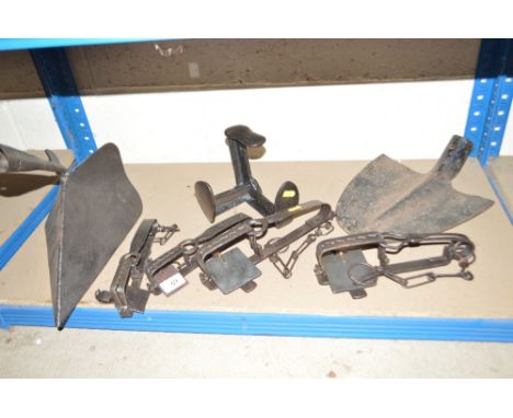 A quantity of Vintage agricultural items to include a ridging tool, a spade head, four traps etc.