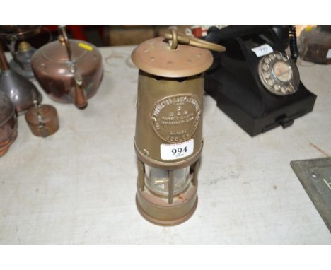 A brass miners safety lamp