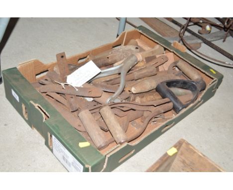 A box of small hand tools and handles