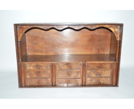 A fine 19th Century walnut display shelf and drawers, 31.5ins wide x 19.5ins high approx.