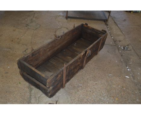 A large Vintage wooden and cast iron trough