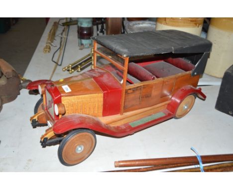 A wooden model of a Vintage car