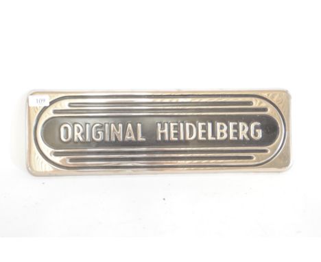 A chrome and enamel plaque, "Original Heidelberg", 20½ins x 6¾ins approx.