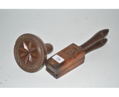 A large 19th Century carved Star sycamore butter stamp and a fruitwood lemon squeezer