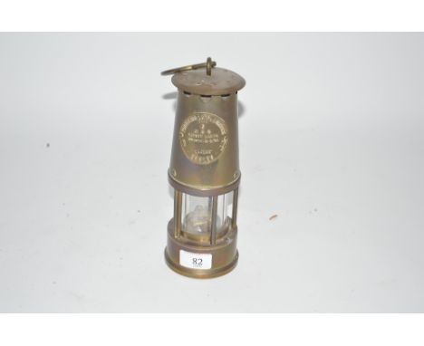 A brass Davey type miner's lamp