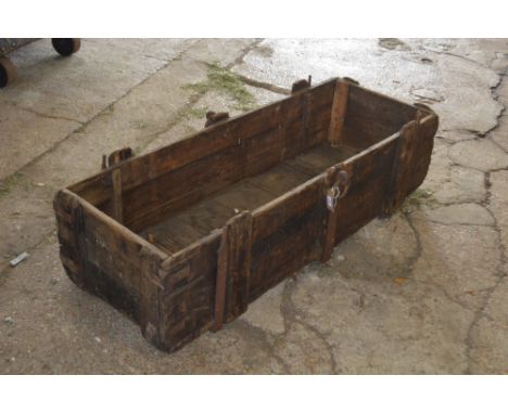 A large Vintage wooden and cast iron trough