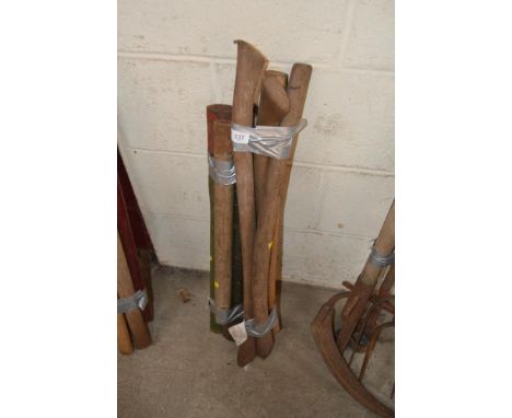 A quantity of wooden axe and pick-axe handles
