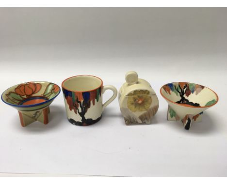 A collection of Clarice Cliff comprising two sugar bowls coffee can and preserve jar and cover