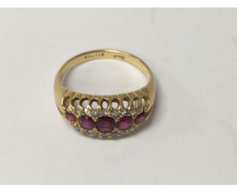 A 18 ct gold ring inset with five rubies size k