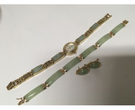 A 14carat gold mounted jade bracelet with matching earrings and a similar watch (not gold)