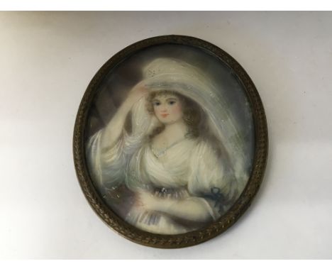 A 19th century portrait watercolour miniature on ivory depicting a bride unsigned unattributed. 9cm including frame.